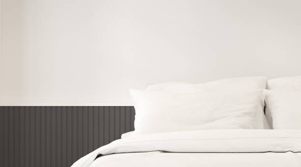 istock Perspective of modern bedroom with white bed and plain wall, Interior design with minimal style. 3D rendering. 1193010032