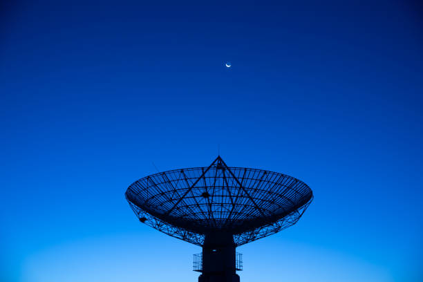 Satellite receiver  in the moonlight Satellite receiver radio telescope stock pictures, royalty-free photos & images