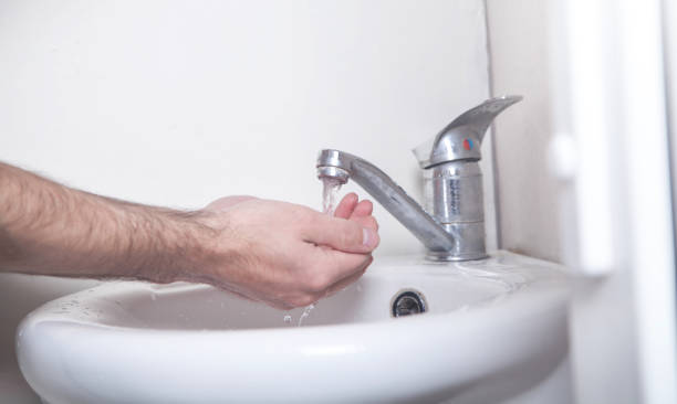 istock Man cleaning hands. Hygiene. Washing hands 1193025112