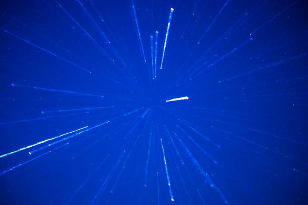 Stars in a night sky appear as slanted lines  in a long exposure with a zoom lens