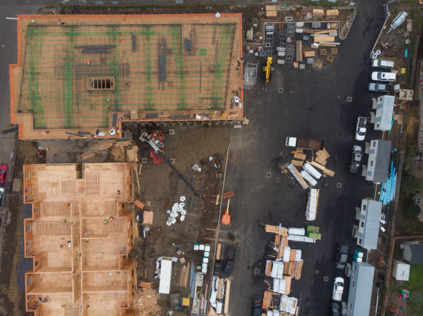 istock Construction and construction of high-rise buildings, the construction industry with working equipment and workers. View from above, from above. Background and texture 1193029439
