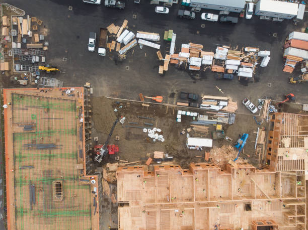 istock Construction and construction of high-rise buildings, construction industry with working equipment and workers. View from above, from above. 1193029902