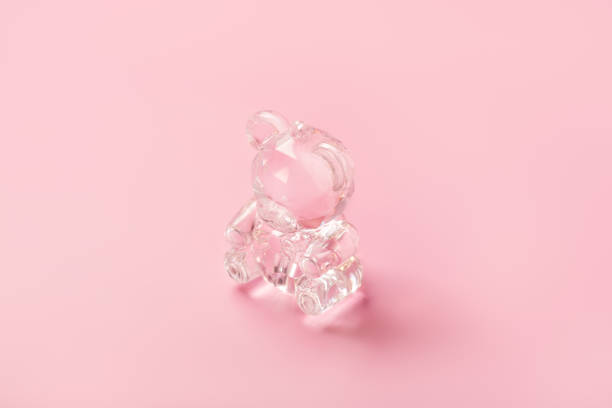 istock Cute crystal teddy bear toy on pink background 1193032813