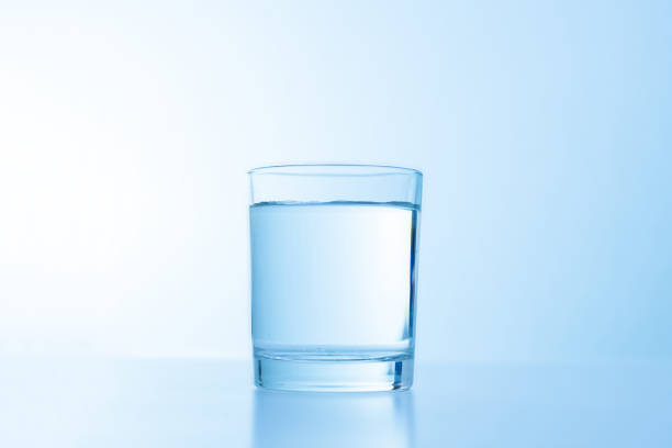 istock a simple glass of water isolated on white. fresh cool drink 1193033521
