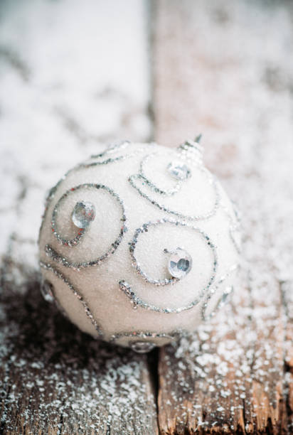 istock Christmas ball on snow flakes 1193033801