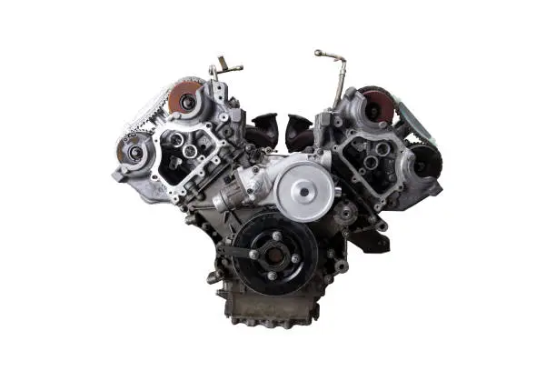 V-shaped engine with six or eight cylinders made of aluminum and metal during repair or replacement on a guarantee on a white isolated background.