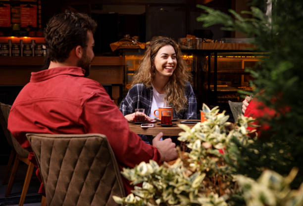 istock Group of Young People Socializing in a Cafe 1193034996