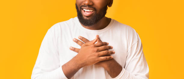 istock African man expressing his feelings, placing hands on chest 1193035867