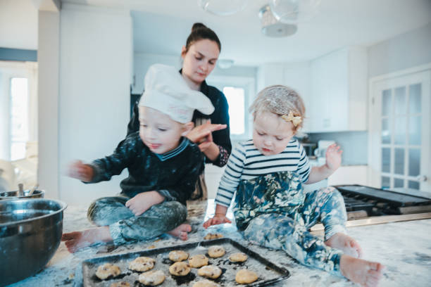 istock Kids playing with cookie dough at the kitchen counter 1193038123