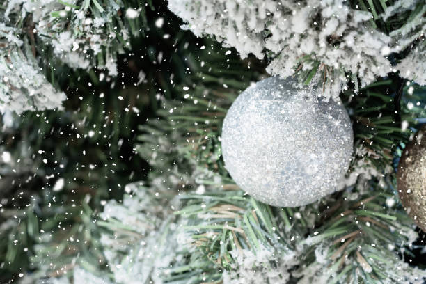 istock Decorated Christmas ball on tree New Year holidays background 1193039394