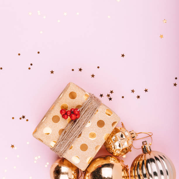 istock Gold jewelry and gift box on pink background 1193042436