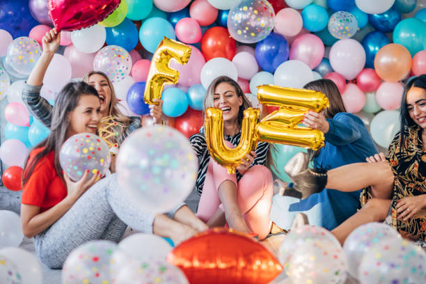 istock Beautiful ladies having fun with balloons 1193042950