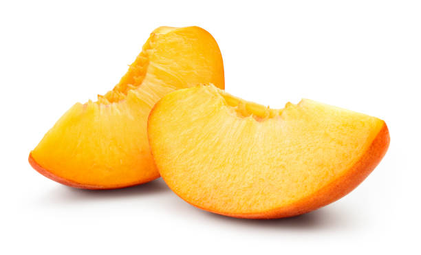 istock Peach slice isolated on white background. Sliced peach. With clipping path. 1193046788
