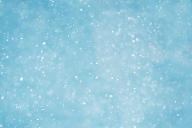 Winter christmas background, blizzard, snowfall. Winter landscape with falling shiny snow