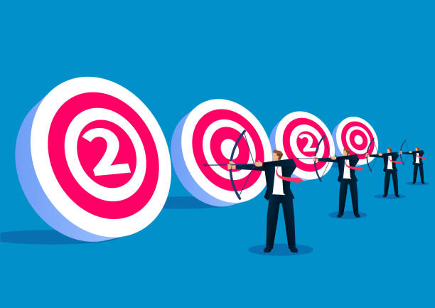 istock New target, four businessmen standing in a row aiming at the target bulls eye shot 1193049849