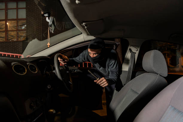 istock Burglar Entering a Car During the Night Hours 1193050176