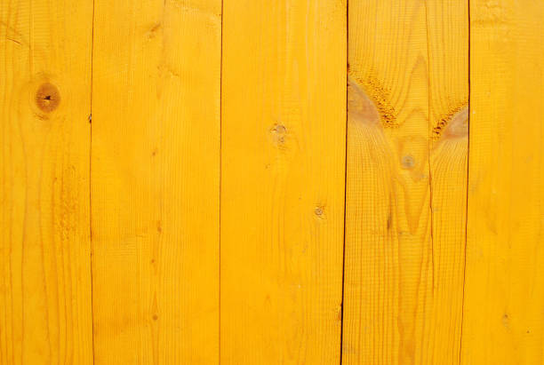 Yellow painted new wooden wall for background