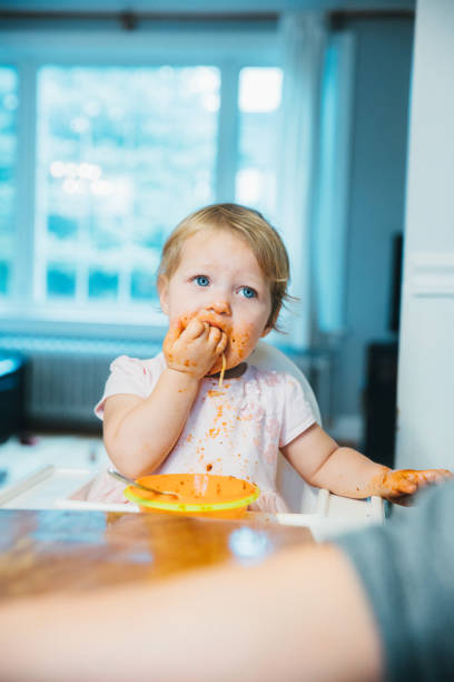 istock Adorable toddler enjoying spaghetti pasta for lunch 1193055474