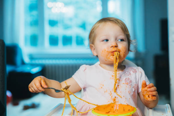 Loving it! - Cute Baby enjoying having spaghetti pasta