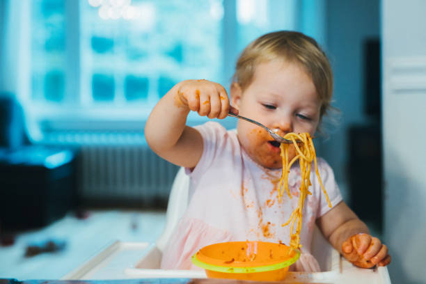 istock Toddler Playing and Eating at the Same Time! 1193056150