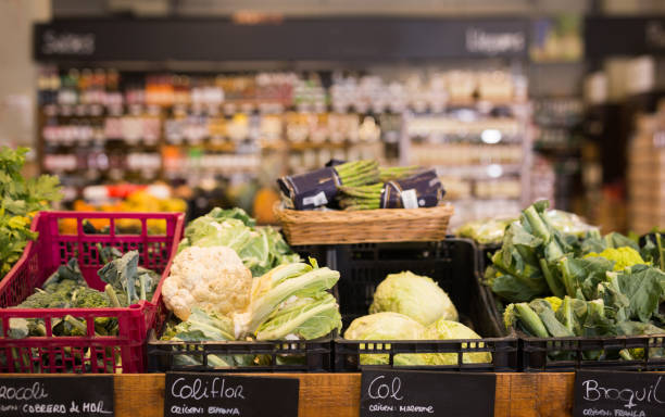 istock Fresh cabbage and broccoli on the counter in the store 1193058314