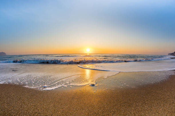 istock Dawn by the sea 1193058362