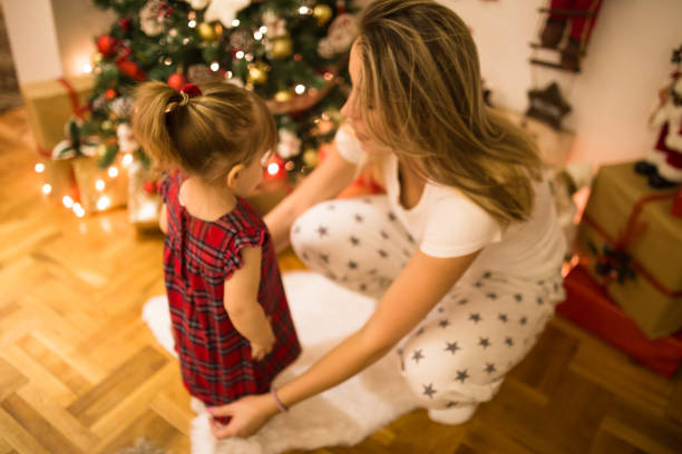 istock Mother preparing daughter for New Year's Eve 1193058902