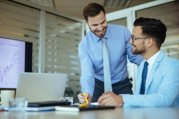 istock Young entrepreneurs analyzing business chart in the office 1193062396