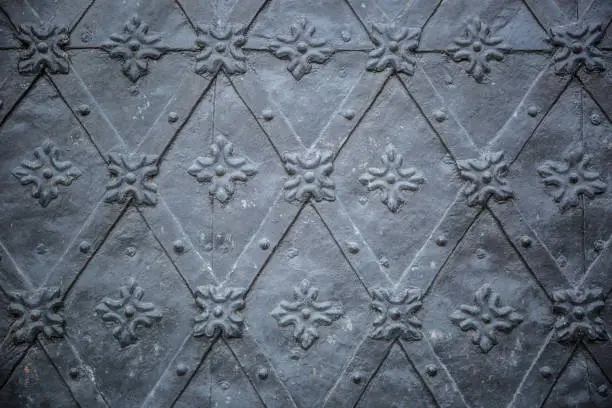 Rustic ancient doors pattern medieval repetitive ornaments.