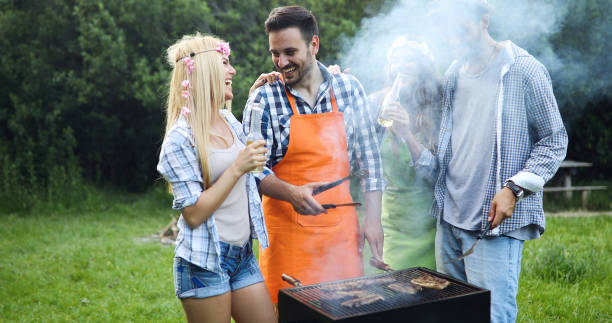 istock Handsome male preparing barbecue and havinf fun together 1193064321