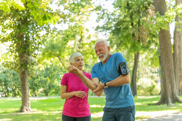 istock Senior Man has an Elbow Injury in Public Park 1193064480