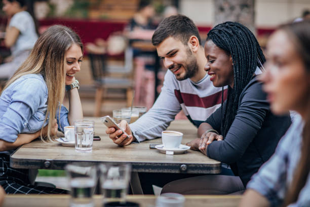 istock Friends sitting outdoors in cafe 1193064723