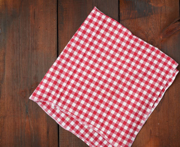 istock white red checkered kitchen towel on a brown wooden background 1193066226