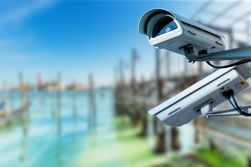 CCTV camera concept with lagoon near the place saint marc in venice on blurry background