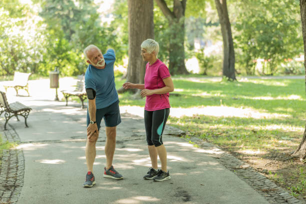 istock Senior Man has a Back Injury in Public Park 1193066999