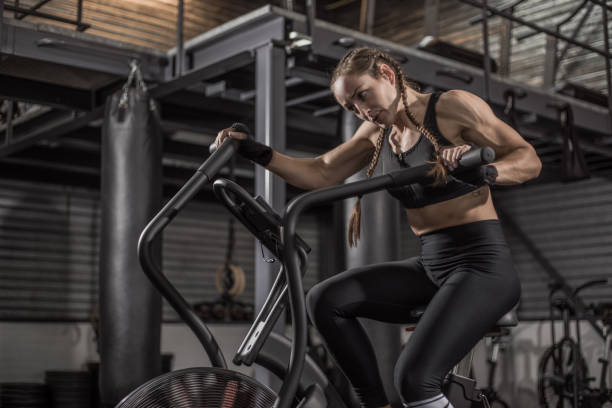istock Female fighter in a black gym 1193067494