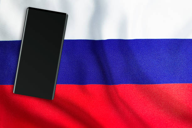 istock Modern Mobile Phone on Full Frame Russian Flag 1193068756