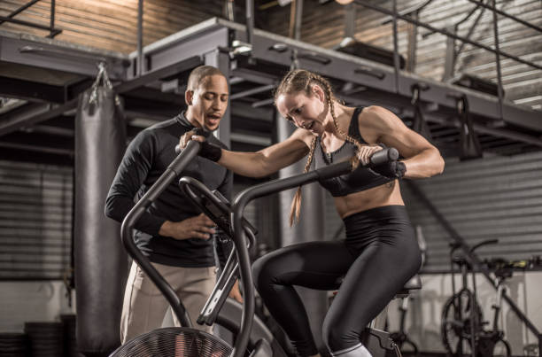 istock Female fighter and male coach during a workout 1193068807