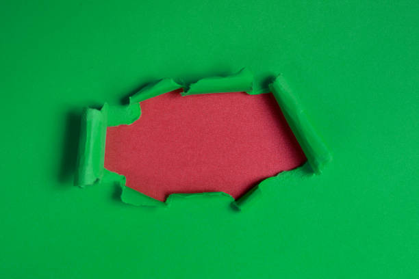 istock Hole in the paper. Ripped paper, space for copy. 1193069408