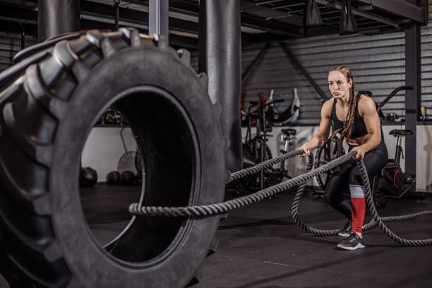 istock Female fighter in a black gym 1193069411