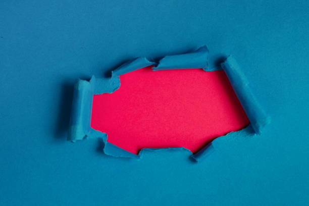 istock Hole in the paper. Ripped paper, space for copy. 1193069463