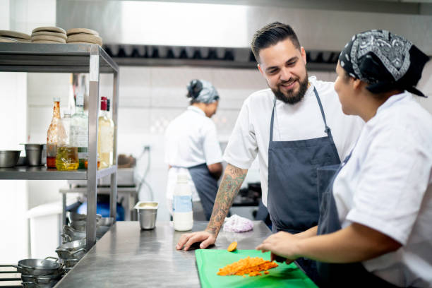 istock Chef talking a employee cutting carrots 1193072500