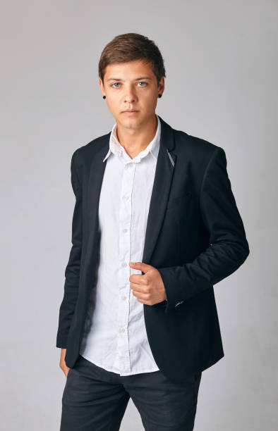 istock handsome young businessman in a stylish jacket standing over a white background 1193075062
