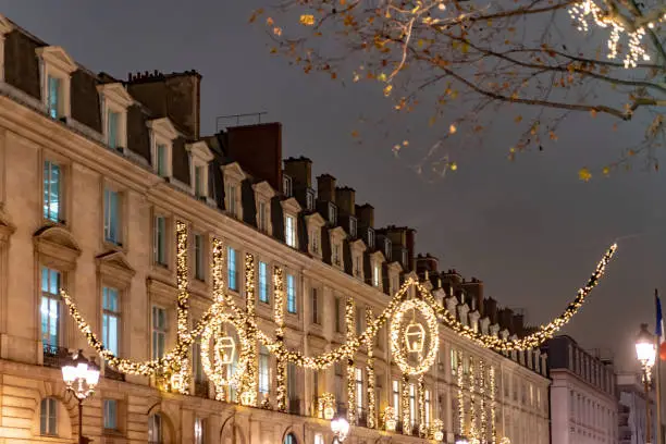 The Rue Lafayette, Paris, France at Christmas with lights in the trees along the Boulevard.
