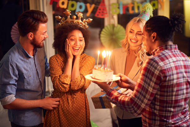 istock Bright birthday cake.young friends having fun on party 1193075562