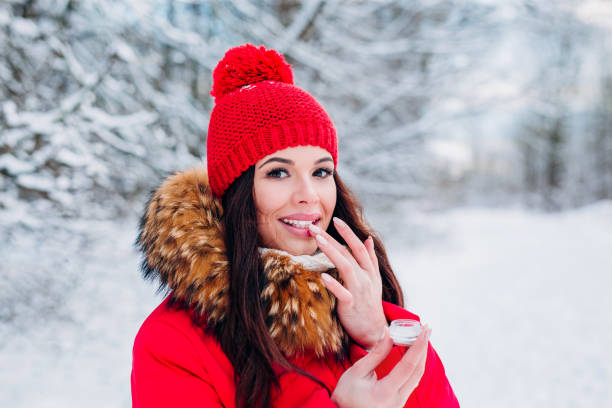 istock Girl protecting lips with lip balm in winter 1193075851
