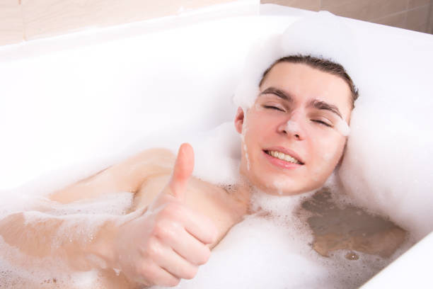 istock Attractive man in the bath with foam. 1193076730