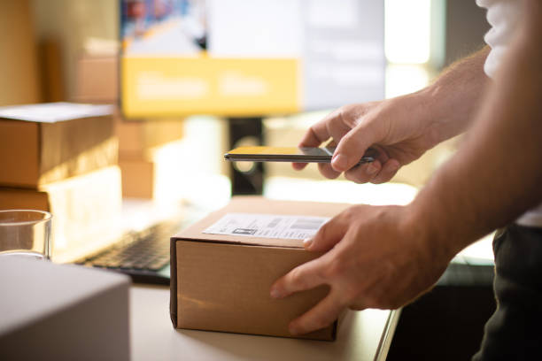 istock Delivery service, scanning a shipping label 1193078182