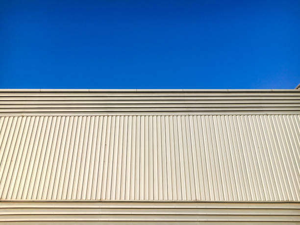 istock Siding metal sheet of building with blue sky. 1193078224