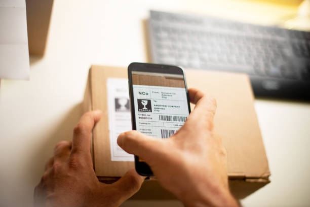 istock Delivery service, scanning a shipping label 1193078237
